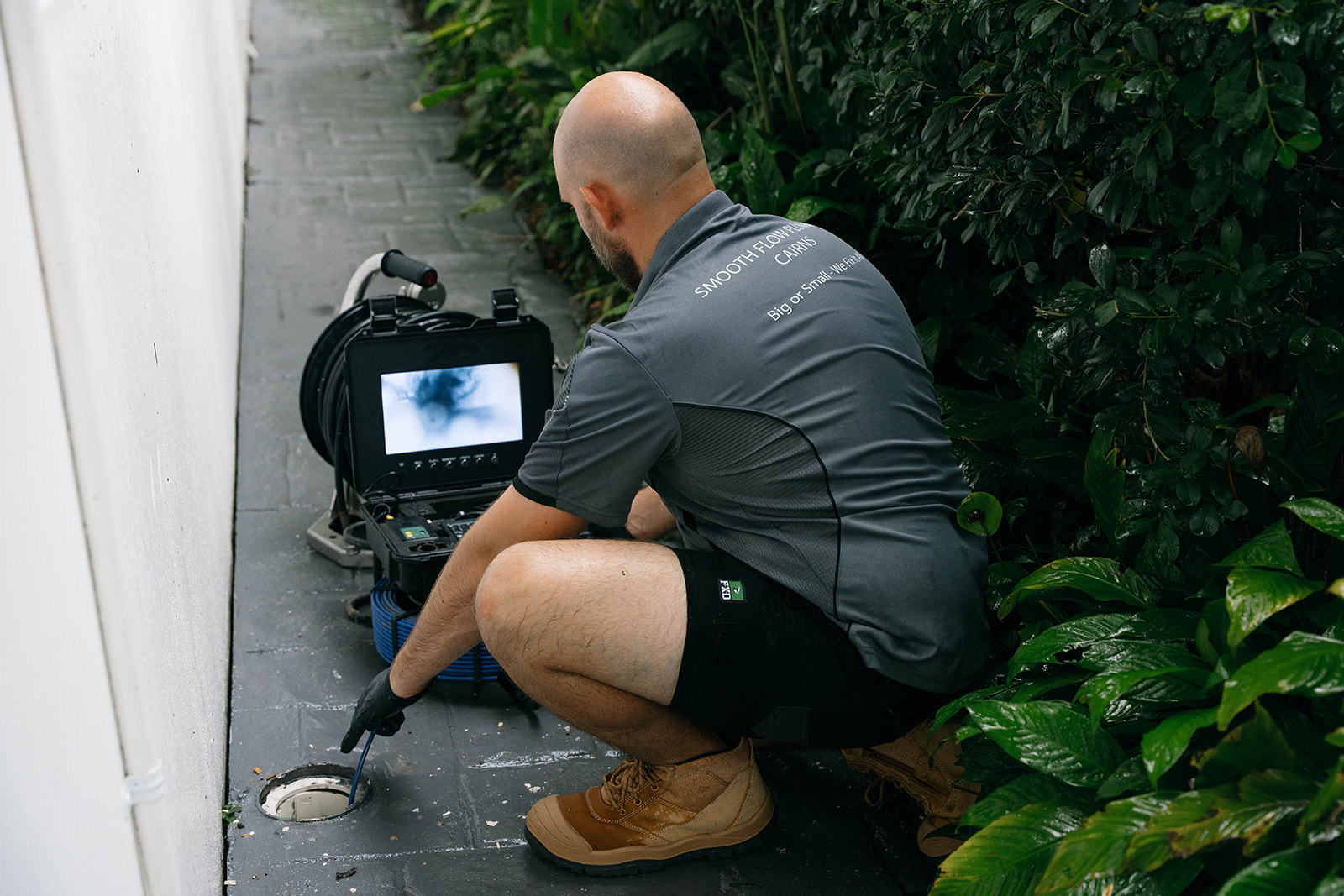 Smooth Flow plumber locating a blocked drain with the camera